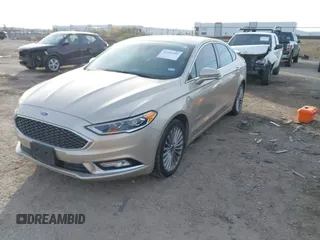 2017 Ford Fusion Titanium z VIN 3FA6P0SU5HR373140, wystawiony jako IAAI lot #41082406 z przebiegiem 98 422 mil mil oraz . Historia ofert i sprzedaży dostępna na DreamBid. Obrazek 18.