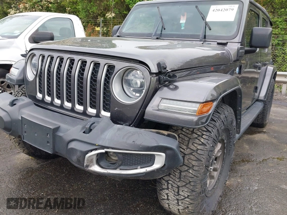 2021 Jeep Wrangler Unlimited Sahara with VIN 1C4JJXP60MW704738, listed as a IAAI auction lot 42042079 with 63,765 mi miles and . Bid and sale history available at DreamBid. Image 6.