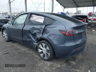 2023 Tesla Model Y Long Range with VIN 7SAYGDEE3PA152683, listed as a IAAI auction lot 41798988 with 14,063 mi miles and . Bid and sale history available at carsss.com. Image 3.