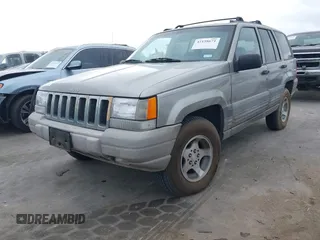 1998 Jeep Grand Cherokee Laredo with VIN 1J4FX58S6WC354101, listed as a IAAI auction lot 42158671 with 289,318 mi miles and . Bid and sale history available at DreamBid. Image 2.