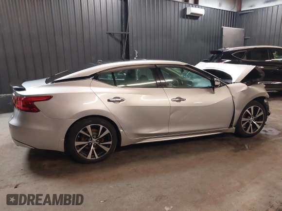 2016 Nissan Maxima SV z VIN 1N4AA6AP4GC415952, wystawiony jako IAAI lot #41806306 z przebiegiem 131 612 mil mil oraz . Historia ofert i sprzedaży dostępna na DreamBid. Obrazek 14.
