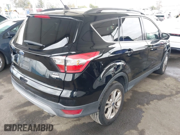 2018 Ford Escape SEL with VIN 1FMCU0HD6JUA86266, listed as a IAAI auction lot 42031613 with 72,798 mi miles and . Bid and sale history available at carsss.com. Image 4.