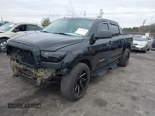 2012 Toyota Tundra 4WD Truck with VIN 5TFDW5F14CX268378, listed as a IAAI auction lot 41412922 with 148,763 mi miles. Bid and sale history available at carsss.com. Image 2.