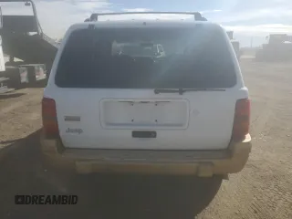 1998 Jeep Grand Cherokee Laredo with VIN 1J4GZ58S9WC361042, listed as a Copart auction lot 46802365 with 236,923 mi miles and Salvage Title. Bid and sale history available at carsss.com. Image 6.