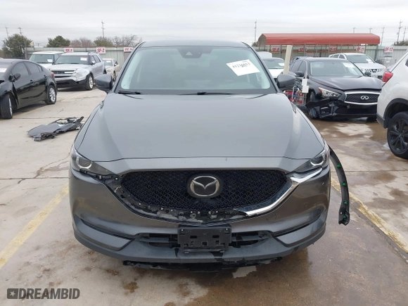2021 Mazda CX-5 Touring with VIN JM3KFBCM0M0342210, listed as a IAAI auction lot 41236013 with 96,012 mi miles. Bid and sale history available at carsss.com. Image 13.