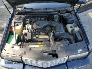 1988 Cadillac Eldorado z VIN 1G6EL1155JU600524, wystawiony jako Copart lot #59505125 z przebiegiem 110 972 mil mil oraz Szkoda całkowita • Salvage title. Historia ofert i sprzedaży dostępna na DreamBid. Obrazek 11.