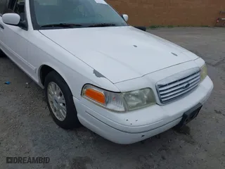 2003 Ford Crown Victoria LX with VIN 2FAFP74WX3X154904, listed as a IAAI auction lot 42094274 with 123,579 mi miles. Bid and sale history available at carsss.com. Image 6.