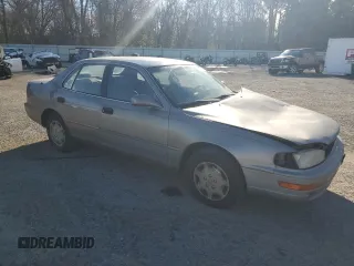 1992 Toyota Camry LE with VIN 4T1SK12E3NU104088, listed as a Copart auction lot 47496735 with 174,957 mi miles and Salvage Title. Bid and sale history available at carsss.com. Image 4.
