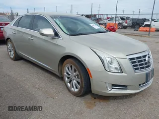 2013 Cadillac XTS Luxury z VIN 2G61P5S30D9132193, wystawiony jako IAAI lot #41897709 z przebiegiem 140 780 mil mil oraz . Historia ofert i sprzedaży dostępna na DreamBid. Obrazek 1.