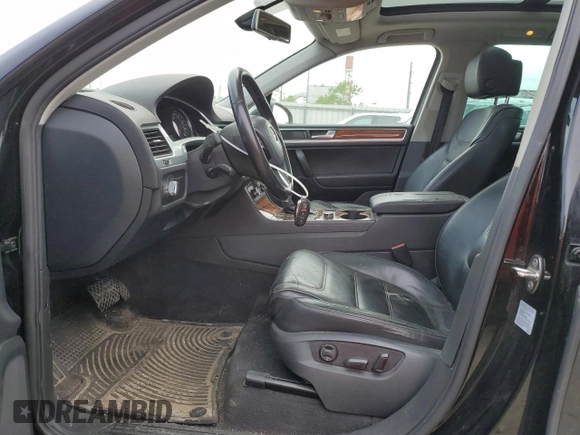 2012 Volkswagen Touareg Sport with VIN WVGFF9BP8CD001039, listed as a Copart auction lot 57764125 with 128,540 mi miles and Clean title. Bid and sale history available at DreamBid. Image 7.