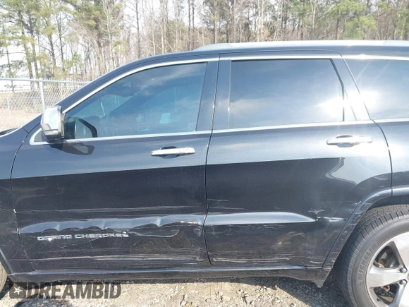 2014 Jeep Grand Cherokee Overland with VIN 1C4RJECG4EC197433, listed as a IAAI auction lot 41769932 with 198,568 mi miles. Bid and sale history available at carsss.com. Image 14.