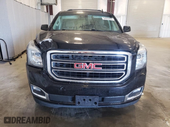 2019 GMC Yukon SLT with VIN 1GKS2BKC2KR238408, listed as a Copart auction lot 54893895 with 69,949 mi miles and Salvage Title. Bid and sale history available at DreamBid. Image 5.