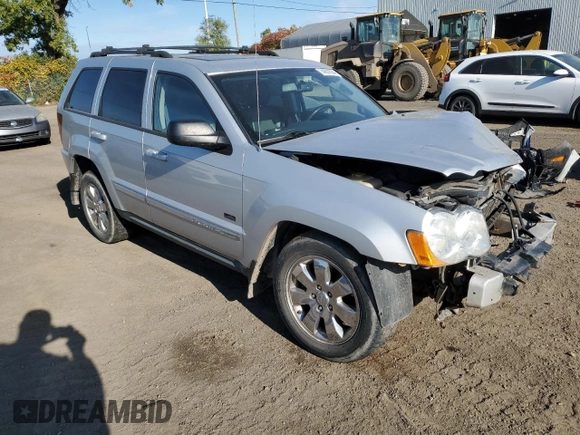 2009 Jeep Grand Cherokee Laredo with VIN 1J8HR48P39C559192, listed as a Copart auction lot 74007094 with 105,997 mi miles and Salvage Title. Bid and sale history available at carsss.com. Image 4.