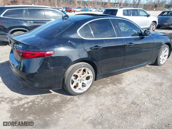 2021 Alfa Romeo Giulia Ti with VIN ZARFANBN1M7649953, listed as a IAAI auction lot 41591153 with 16,672 mi miles. Bid and sale history available at carsss.com. Image 4.