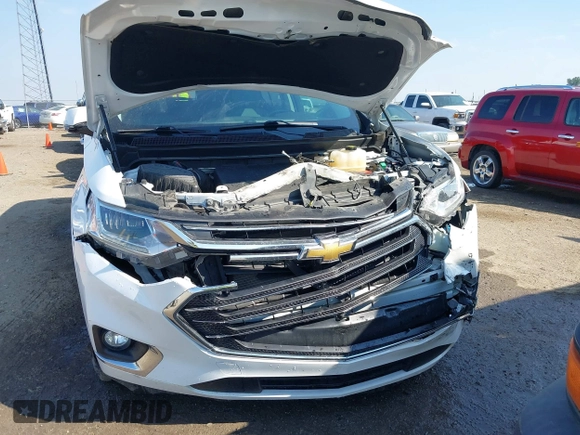 2018 Chevrolet Traverse Premier z VIN 1GNERKKW6JJ220965, wystawiony jako IAAI lot #37625637 z przebiegiem 99 072 mil mil oraz . Historia ofert i sprzedaży dostępna na DreamBid. Obrazek 6.