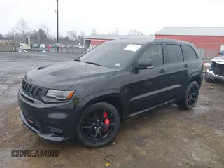 2018 Jeep Grand Cherokee SRT z VIN 1C4RJFDJ2JC391503, wystawiony jako IAAI lot #41717243 z przebiegiem 78 157 mil mil oraz . Historia ofert i sprzedaży dostępna na DreamBid. Obrazek 17.