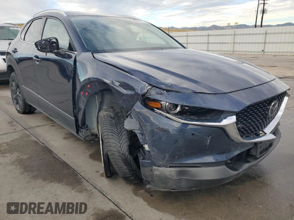 2023 Mazda CX-30 Premium Plus with VIN 3MVDMBEY9PM500907, listed as a Copart auction lot 70871494 with 38,599 mi miles and Salvage title. Bid and sale history available at DreamBid. Image 4.