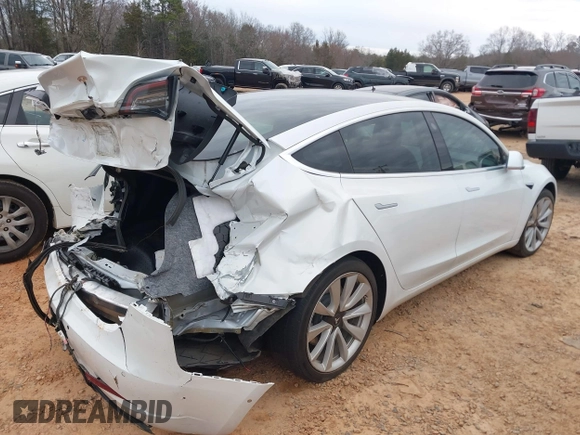 2020 Tesla Model 3 Standard Range Plus with VIN 5YJ3E1EA1LF738062, listed as a IAAI auction lot 41747581 with 41,897 mi miles. Bid and sale history available at carsss.com. Image 4.