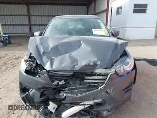 2016 Mazda CX-5 Sport with VIN JM3KE4BY0G0623365, listed as a IAAI auction lot 41525002 with 127,674 mi miles and . Bid and sale history available at carsss.com. Image 12.