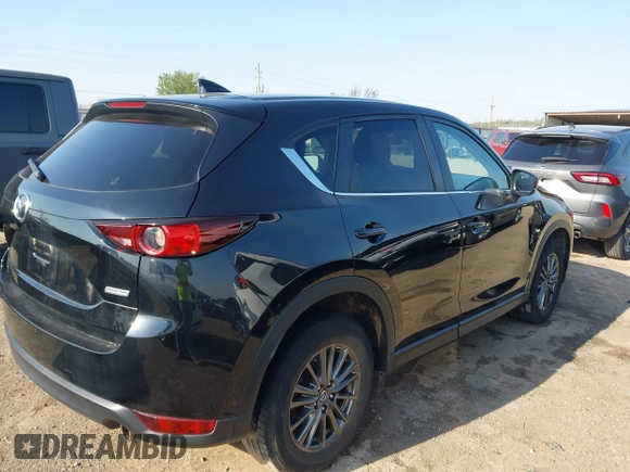 2019 Mazda CX-5 Touring with VIN JM3KFACM6K0533203, listed as a IAAI auction lot 41973125 with 106,882 mi miles and . Bid and sale history available at carsss.com. Image 4.