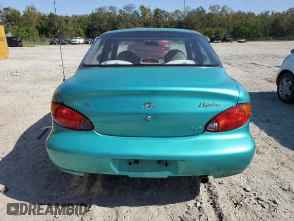2000 Hyundai Elantra GLS z VIN KMHJF35FXYU998689, wystawiony jako Copart lot #76181814 z przebiegiem 154 743 mil mil oraz Szkoda całkowita • Salvage title. Historia ofert i sprzedaży dostępna na DreamBid. Obrazek 6.