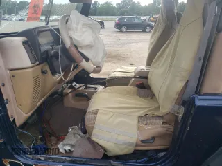 2000 Jeep Wrangler Sport with VIN 1J4FA49S0YP770943, listed as a Copart auction lot 68615524 with 165,377 mi miles and Salvage Title. Bid and sale history available at carsss.com. Image 7.
