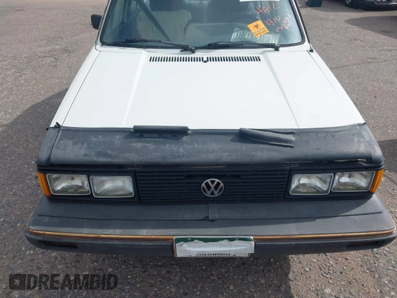1982 Volkswagen Jetta z VIN WVWGA9161CW521961, wystawiony jako IAAI lot #42373314 z przebiegiem 52 051 mil mil oraz . Historia ofert i sprzedaży dostępna na DreamBid. Obrazek 6.