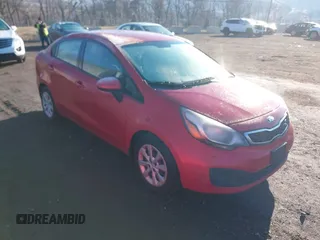 2015 Kia Rio EX with VIN KNADN4A36F6427415, listed as a IAAI auction lot 41671078 with 137,013 mi miles. Bid and sale history available at carsss.com. Image 1.