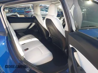 2021 Tesla Model Y Standard Range with VIN 5YJYGDED5MF121874, listed as a IAAI auction lot 41238170 with 72,041 mi miles and . Bid and sale history available at DreamBid. Image 8.