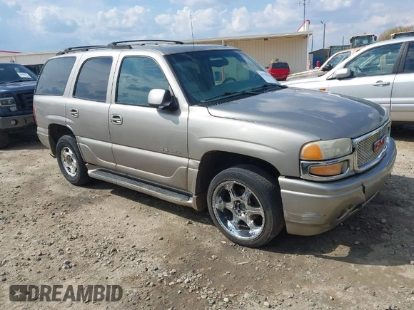 2002 GMC Yukon Denali z VIN 1GKEK63U52J202688, wystawiony jako IAAI lot #41778920 z przebiegiem 354 202 mil mil oraz . Historia ofert i sprzedaży dostępna na DreamBid. Obrazek 1.