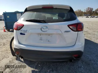 2013 Mazda CX-5 Sport z VIN JM3KE4BEXD0158031, wystawiony jako Copart lot #77827644 z przebiegiem Nie podano mil oraz Szkoda całkowita • Salvage title. Historia ofert i sprzedaży dostępna na DreamBid. Obrazek 6.