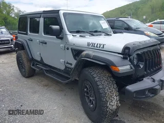 2023 Jeep Wrangler Sport S z VIN 1C4HJXDN0PW511682, wystawiony jako IAAI lot #42199890 z przebiegiem 29 061 mil mil oraz . Historia ofert i sprzedaży dostępna na DreamBid. Obrazek 1.