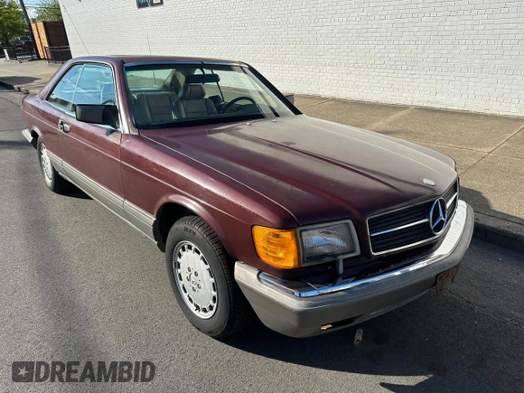 1986 Mercedes-Benz 560 with VIN WDBCA45D2GA206016, listed as a Copart auction lot 54577205 with 205,332 mi miles and Clean Title. Bid and sale history available at DreamBid. Image 1.