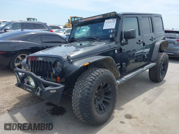 2012 Jeep Wrangler Unlimited Sport with VIN 1C4BJWDG3CL200826, listed as a IAAI auction lot 42261113 with 135,554 mi miles and . Bid and sale history available at DreamBid. Image 18.