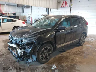 2018 Honda CR-V Touring with VIN 2HKRW2H94JH635053, listed as a IAAI auction lot 41611501 with 76,883 mi miles. Bid and sale history available at carsss.com. Image 2.