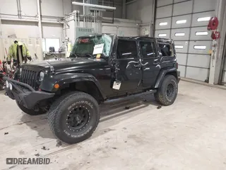 2011 Jeep Wrangler Unlimited Sahara with VIN 1J4HA5H12BL557059, listed as a IAAI auction lot 41856882 with 150,683 mi miles. Bid and sale history available at carsss.com. Image 2.