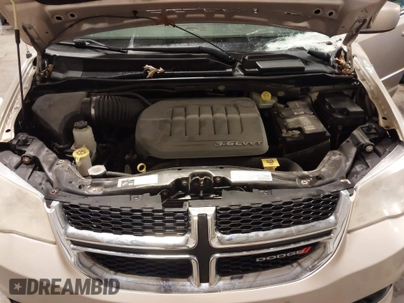 2013 Dodge Grand Caravan SXT with VIN 2C4RDGCG0DR567186, listed as a IAAI auction lot 41706119 with 112,512 mi miles and . Bid and sale history available at DreamBid. Image 10.