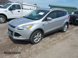 2016 Ford Escape Titanium with VIN 1FMCU9JX3GUA62802, listed as a IAAI auction lot 42001690 with 124,452 mi miles. Bid and sale history available at carsss.com. Image 17.