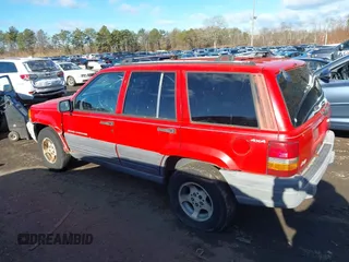 1997 Jeep Grand Cherokee Laredo with VIN 1J4GZ58S0VC550242, listed as a IAAI auction lot 41032114 with 185,307 mi miles. Bid and sale history available at carsss.com. Image 14.