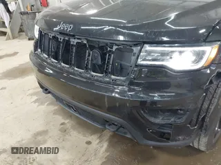 2021 Jeep Grand Cherokee Laredo X with VIN 1C4RJFAG5MC817567, listed as a IAAI auction lot 42297526 with 71,387 mi miles and . Bid and sale history available at DreamBid. Image 6.