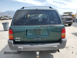 1996 Jeep Grand Cherokee Laredo z VIN 1J4GZ58S8TC222435, wystawiony jako Copart lot #62347665 z przebiegiem 202 125 mil mil oraz Czysty tytuł • Clean title. Historia ofert i sprzedaży dostępna na DreamBid. Obrazek 6.
