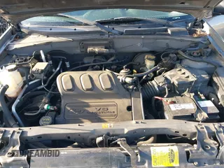 2004 Ford Escape with VIN 1FMCU02174KA61956, listed as a IAAI auction lot 41913605 with 166,587 mi miles and . Bid and sale history available at DreamBid. Image 10.