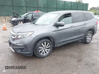 2021 Honda Pilot EX-L with VIN 5FNYF6H5XMB048102, listed as a IAAI auction lot 42346372 with 45,042 mi miles and . Bid and sale history available at DreamBid. Image 2.
