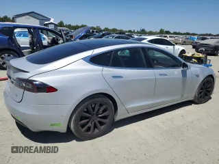 2016 Tesla Model S 90D с VIN 5YJSA1E23GF144496, выставлен на аукционе Copart как лот 64080845 с пробегом 34 847 миль миль и Списание • Salvage title. История ставок и продаж доступна на DreamBid. Изображение 3.