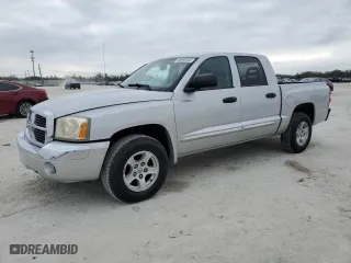 2006 Dodge Dakota Laramie with VIN 1D7HE58N06S641184, listed as a Copart auction lot 43596945 with 173,809 mi miles and Salvage Title. Bid and sale history available at carsss.com. Image 1.