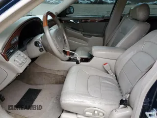 2004 Cadillac DeVille DTS z VIN 1G6KF579X4U203102, wystawiony jako Copart lot #50426955 z przebiegiem 157 290 mil mil oraz Szkody całkowita. Historia ofert i sprzedaży dostępna na DreamBid. Obrazek 7.