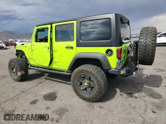 2012 Jeep Wrangler Unlimited Call of Duty MW3 z VIN 1C4BJWFG4CL242211, wystawiony jako Copart lot #59774555 z przebiegiem 117 463 mil mil oraz Szkoda całkowita • Salvage title. Historia ofert i sprzedaży dostępna na DreamBid. Obrazek 2.