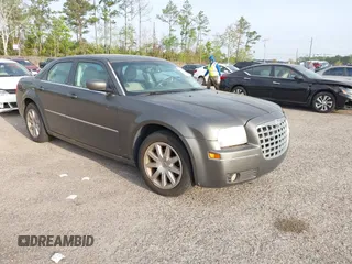 2009 Chrysler 300 Touring with VIN 2C3LA53V49H516390, listed as a IAAI auction lot 41821340 with 141,882 mi miles. Bid and sale history available at carsss.com. Image 1.