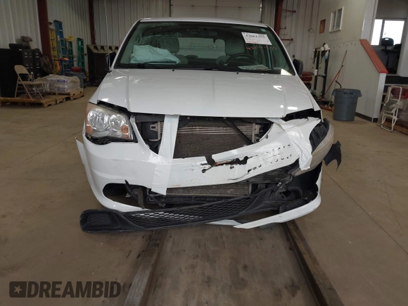 2014 Dodge Grand Caravan American Value with VIN 2C4RDGBG7ER345277, listed as a IAAI auction lot 42061355 with 145,889 mi miles and . Bid and sale history available at DreamBid. Image 6.