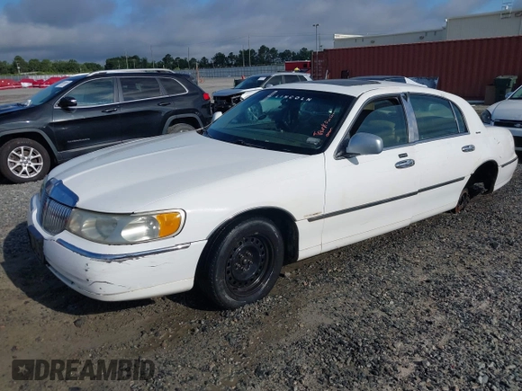 1999 Lincoln Town Car Signature with VIN 1LNHM82W0XY710627, listed as a IAAI auction lot 42440024 with 268,639 mi miles and . Bid and sale history available at DreamBid. Image 2.